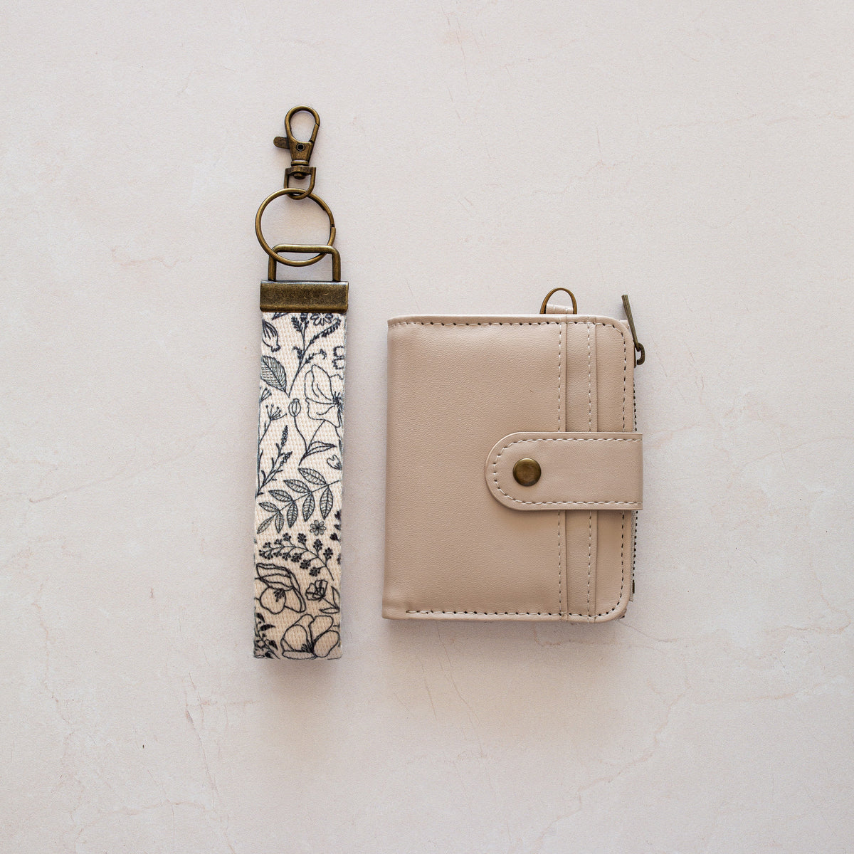 Beige bifold wallet with Black Floral wrist lanyard