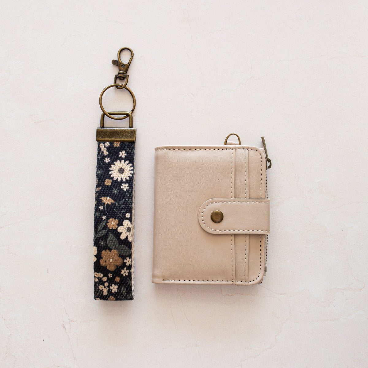 Beige bifold wallet with Black Tan Flower wrist lanyard