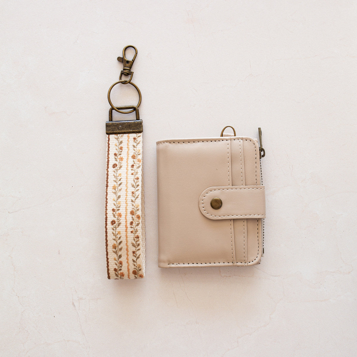 Beige bifold wallet with Harvest Wildflower wrist lanyard